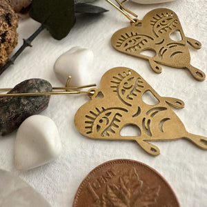 files/boulevard-of-broken-dreams-raw-brass-crying-heart-face-drop-earrings-584388.jpg