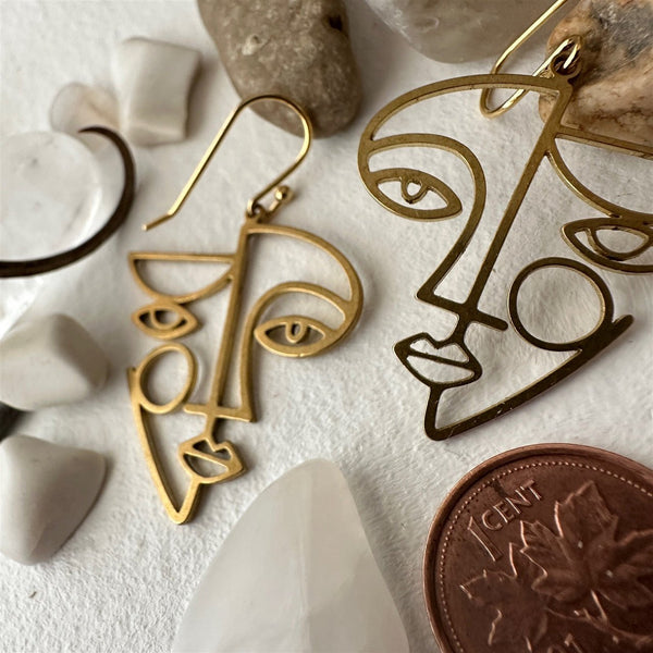 Klee Geometric Face Silhouette Drop Earrings In Raw Brass - Lady of the Lake