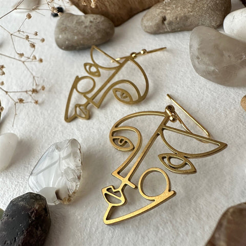 Klee Geometric Face Silhouette Drop Earrings In Raw Brass - Lady of the Lake